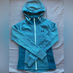 Under Armor zip up hoody. Two front pockets and a hood. Cold gear